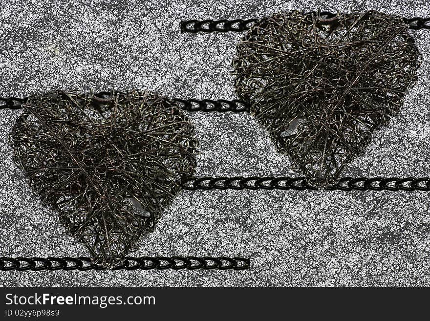 Heart of steel wire and chain isolated on white background.