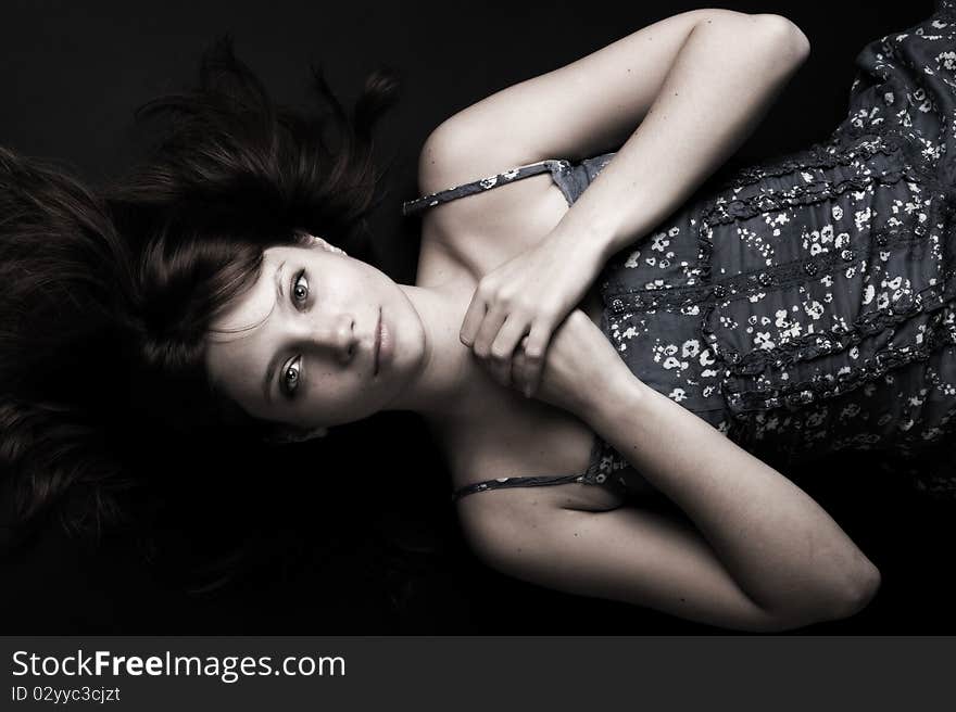 A girl lying on the floor. Toned image