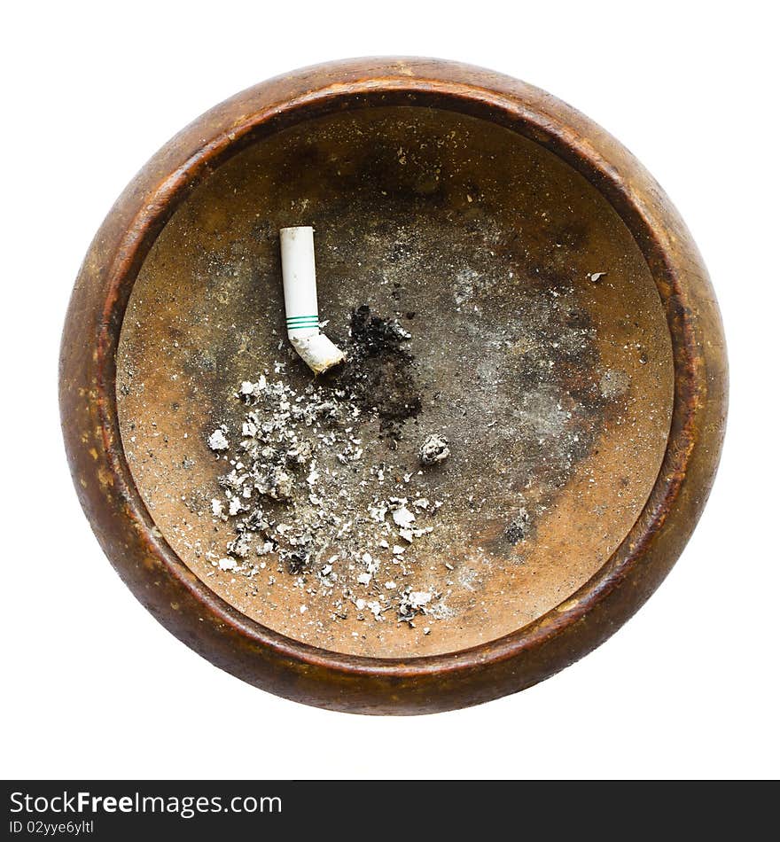 Old wooden ashtray with ash and crushed cigarette