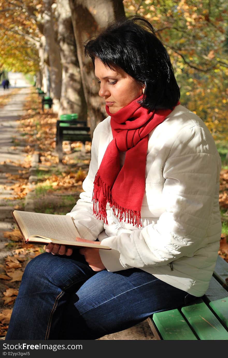 Young woman reading in the park