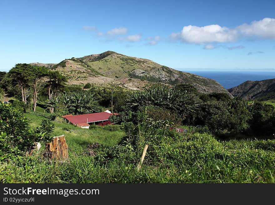 A country cottage tucked into the lush countryside of the Thompsons Wood district on a bright sunny day on St Helena Island. A country cottage tucked into the lush countryside of the Thompsons Wood district on a bright sunny day on St Helena Island.