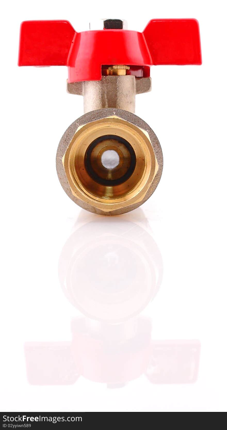 The water valve from a brass with the red handle on a white background