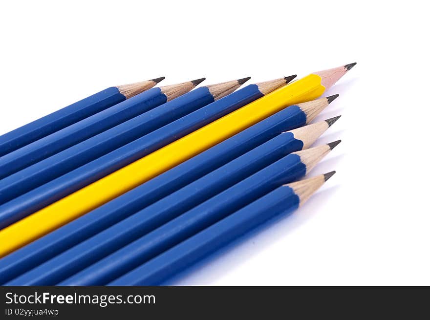 Row of pencils in form of arrow