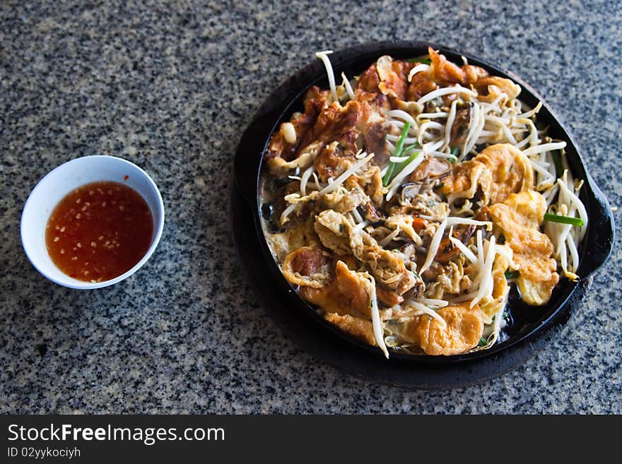 The oyster fried in hotplate. The oyster fried in hotplate