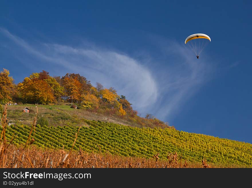 Paraglider in a blue sky