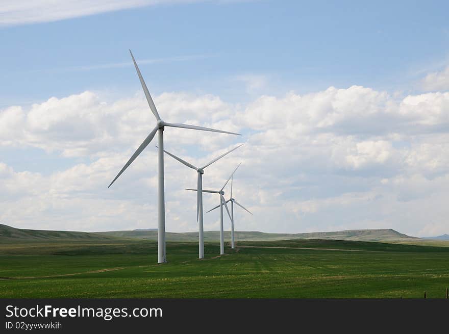 Wind turbines in green fields