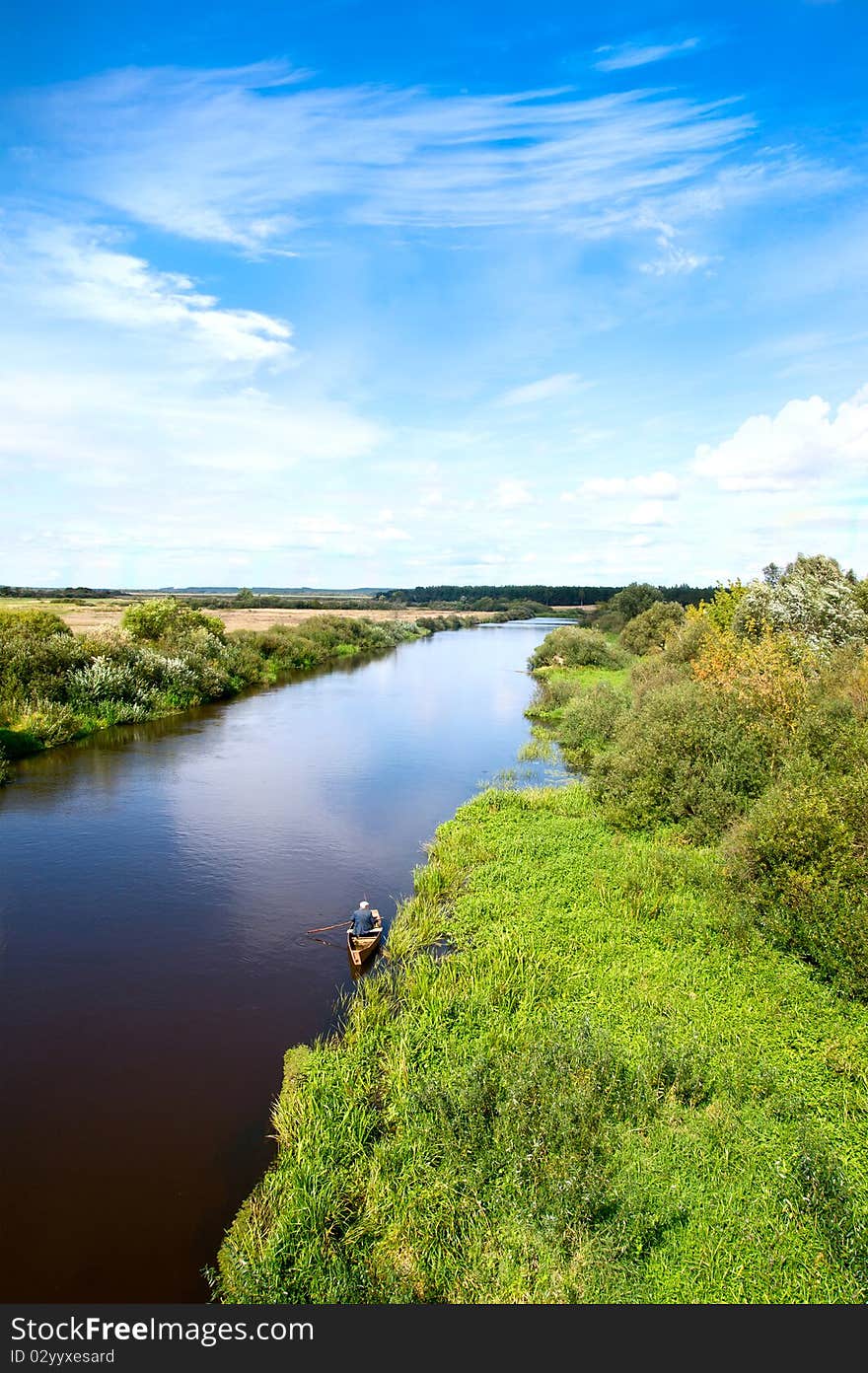 Blue river, cloud sky, green shors