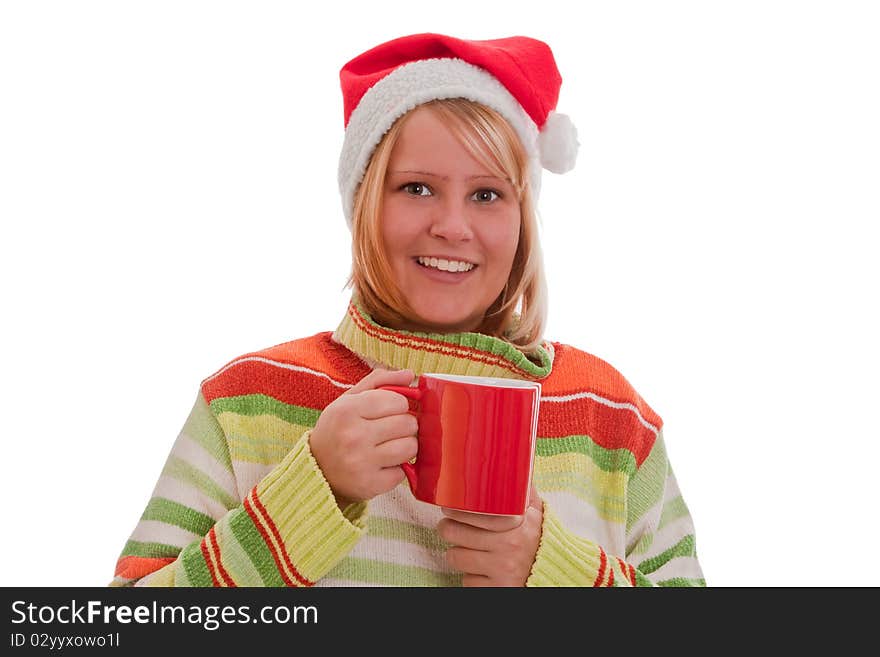 Young woman with santa hat holding a red cup - isolated. Young woman with santa hat holding a red cup - isolated