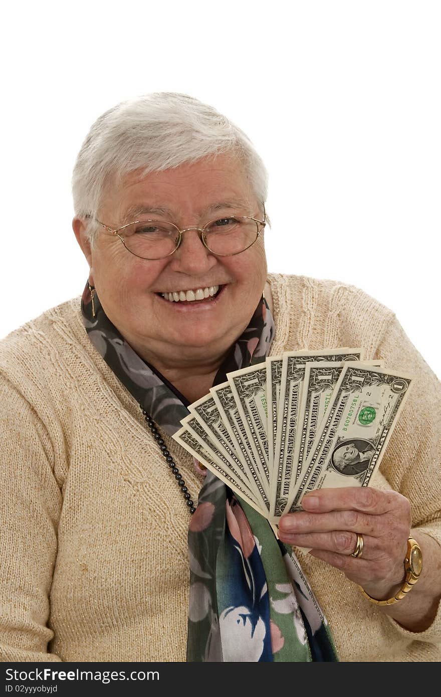 Old woman holding dollars and laughing - isolated on white. Old woman holding dollars and laughing - isolated on white