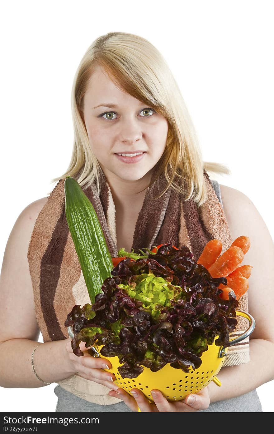 Young woman presenting fresh vegetables - isolated on white. Young woman presenting fresh vegetables - isolated on white