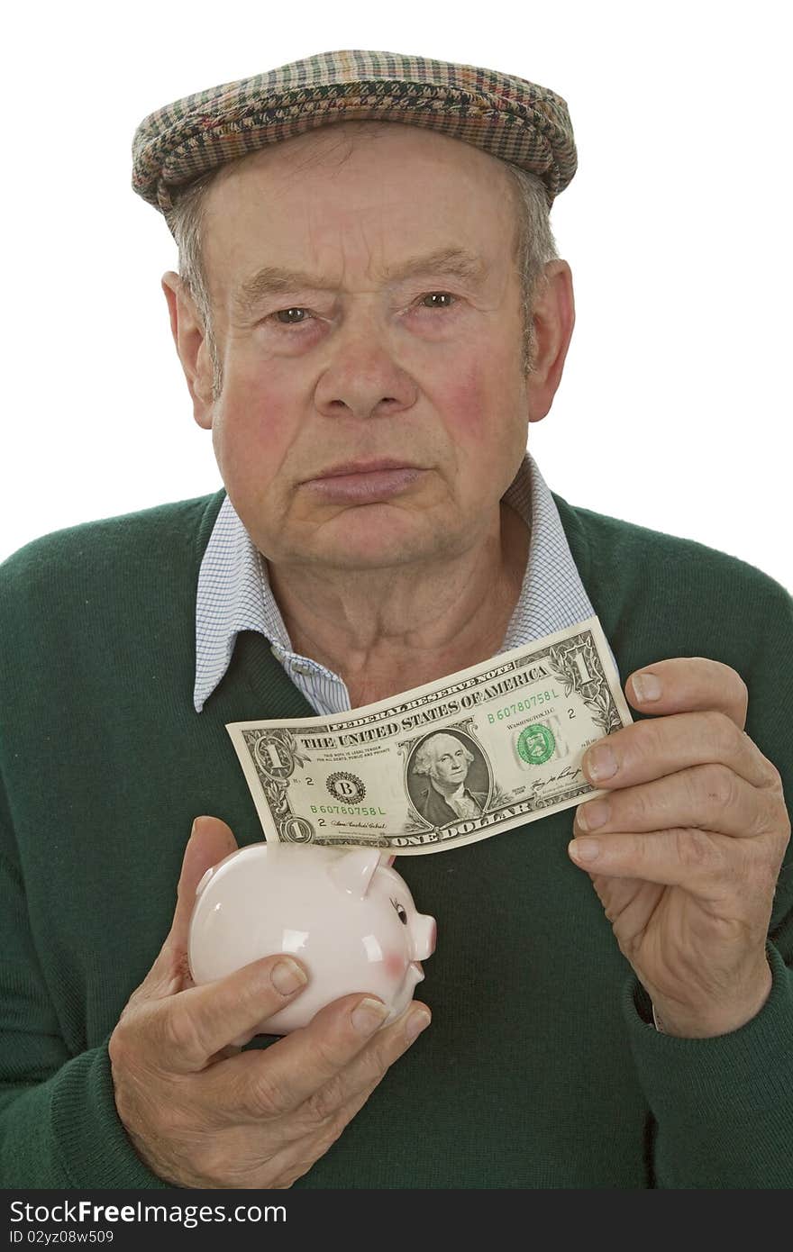 Male Senior with piggy bank isolated on white background