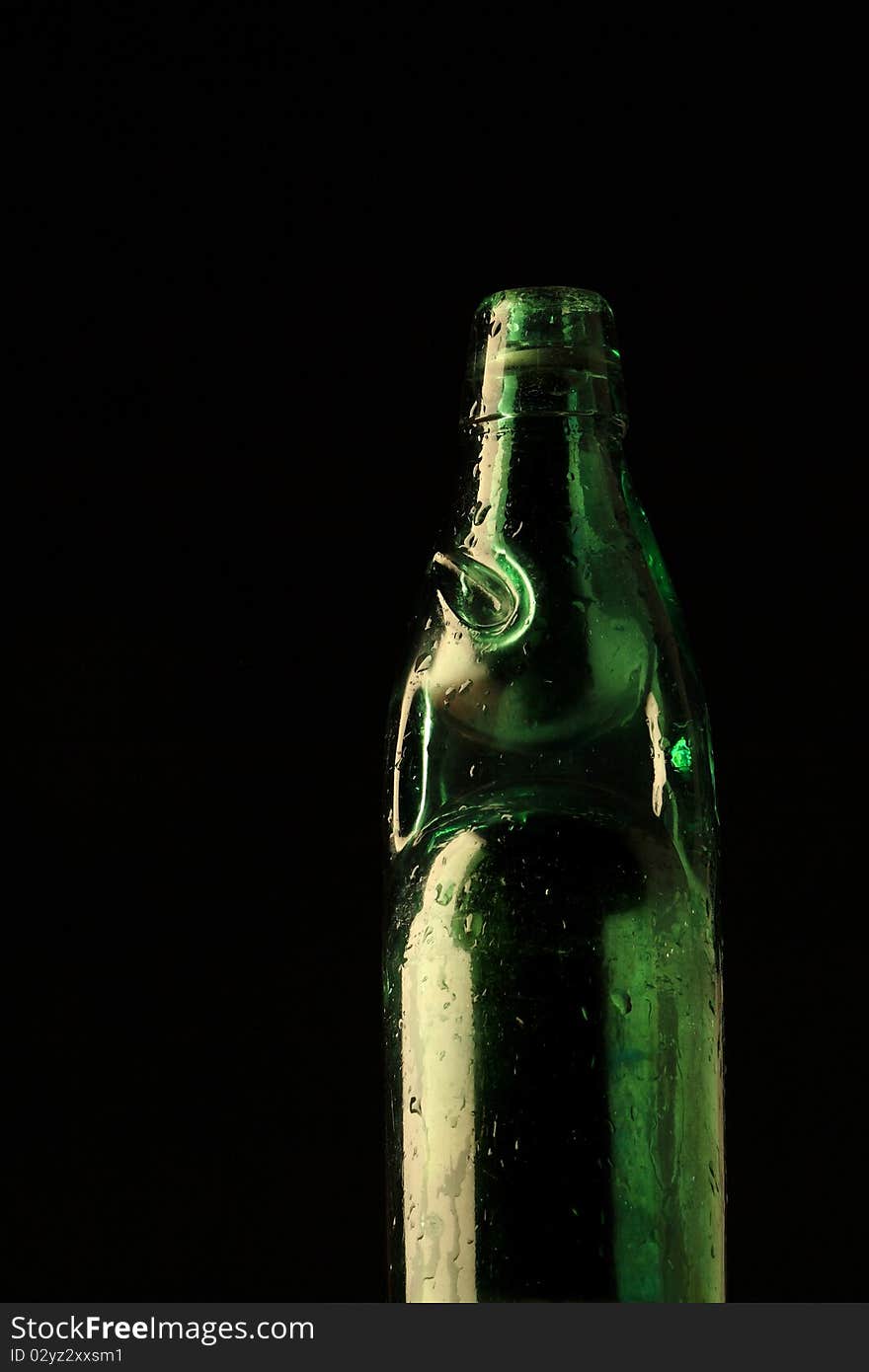 Vintage style soda bottle in a dark background