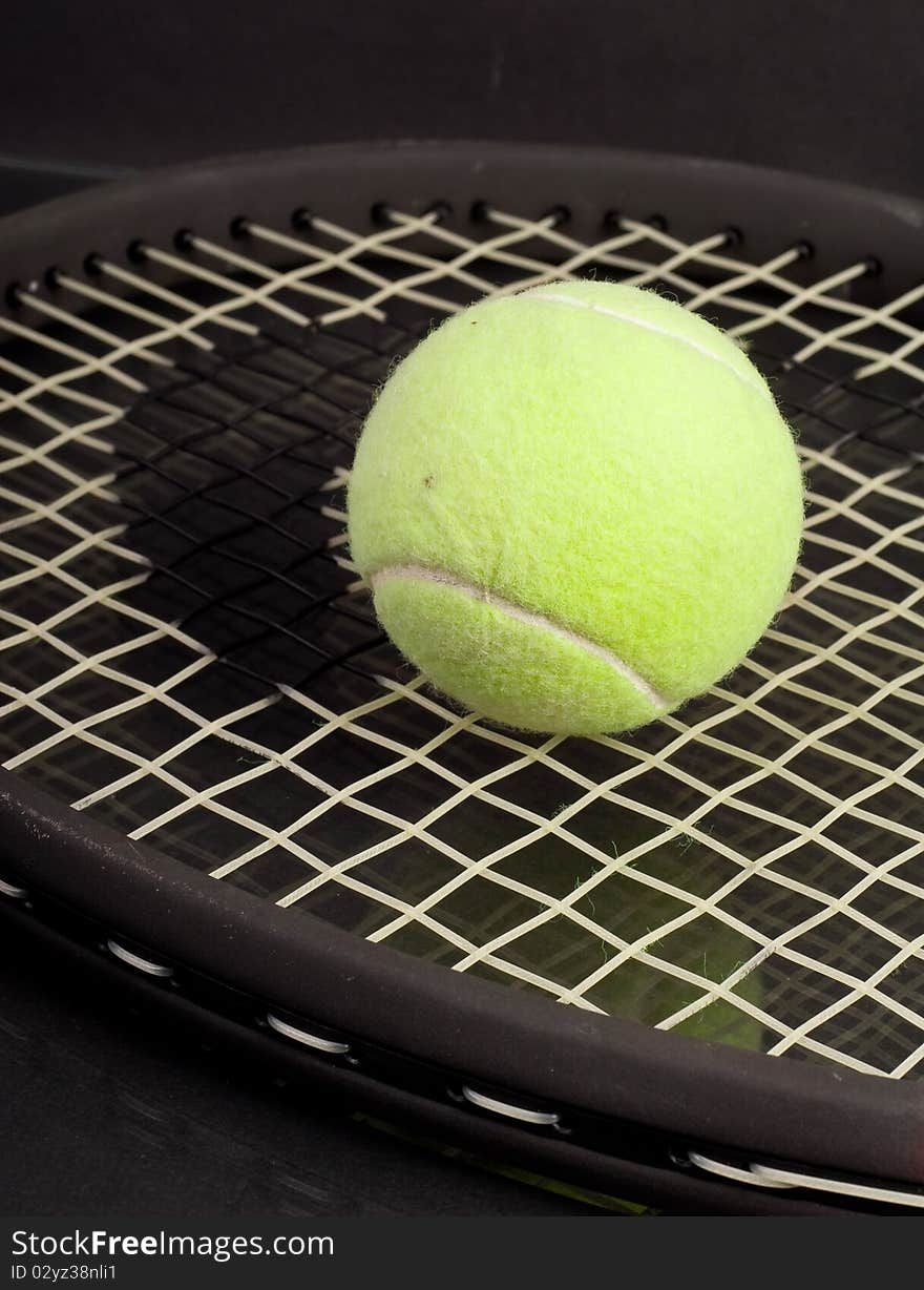 Tennis Ball on Racket