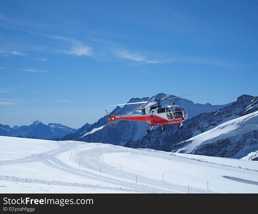 Vehicles flying helicopter for rescue Life at Jungfraujoch Top of Europe in the Swiss Mountains. Vehicles flying helicopter for rescue Life at Jungfraujoch Top of Europe in the Swiss Mountains