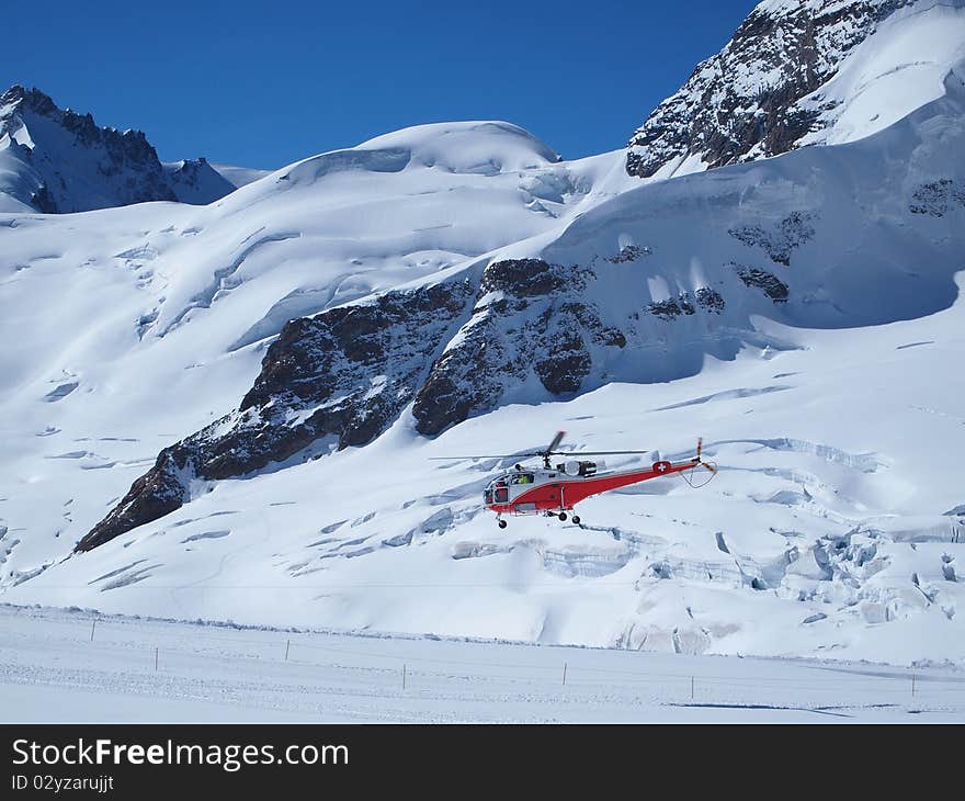 Vehicles flying helicopter for rescue Life at Jungfraujoch Top of Europe in the Swiss Mountains. Vehicles flying helicopter for rescue Life at Jungfraujoch Top of Europe in the Swiss Mountains