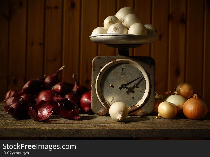 Pile of onion on a table. Old ferruginous scales.