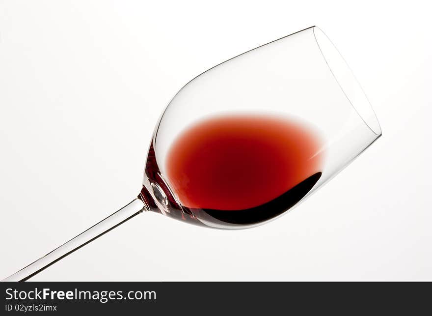 Glass of red wine and white background