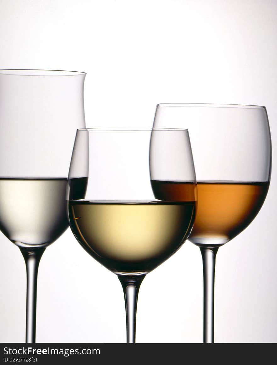 Three glasses of wine with a white background