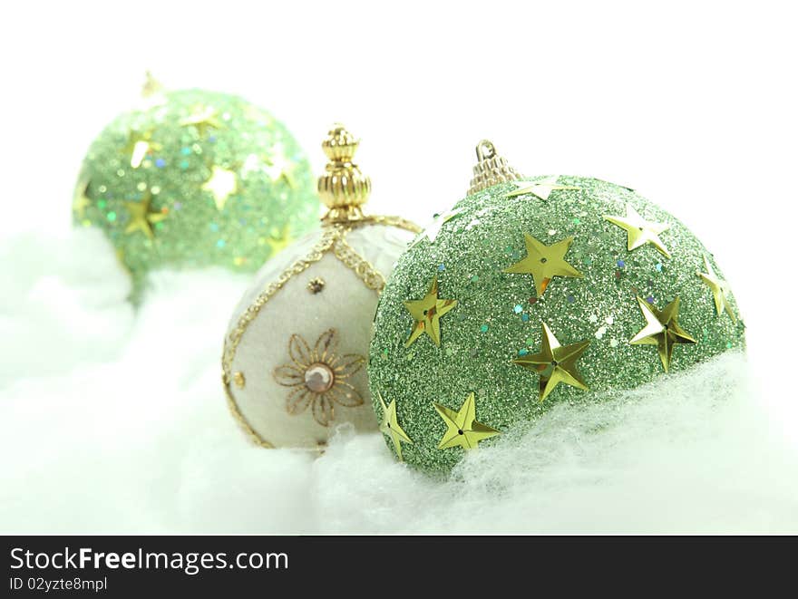 Green Christmas balls on cloudy background. Xmas image