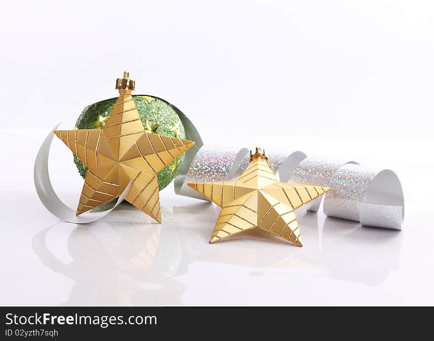 Gold star with serpentine and green ball, xmas image. Gold star with serpentine and green ball, xmas image