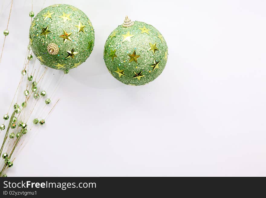 Green christmas balls on white background, Space to add text or design. Green christmas balls on white background, Space to add text or design