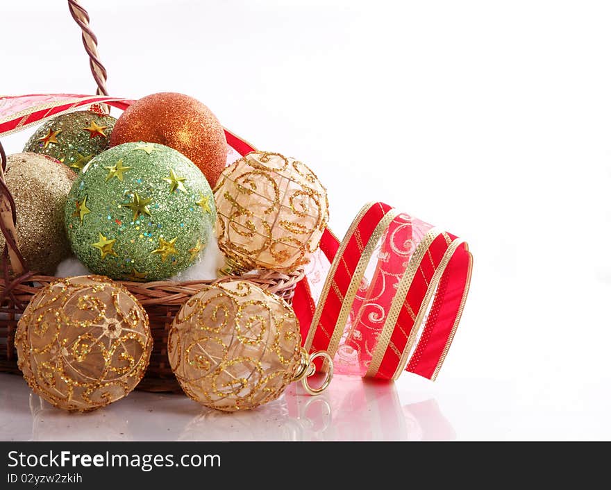 Green, gold and orange balls with red ribbon, christmas image