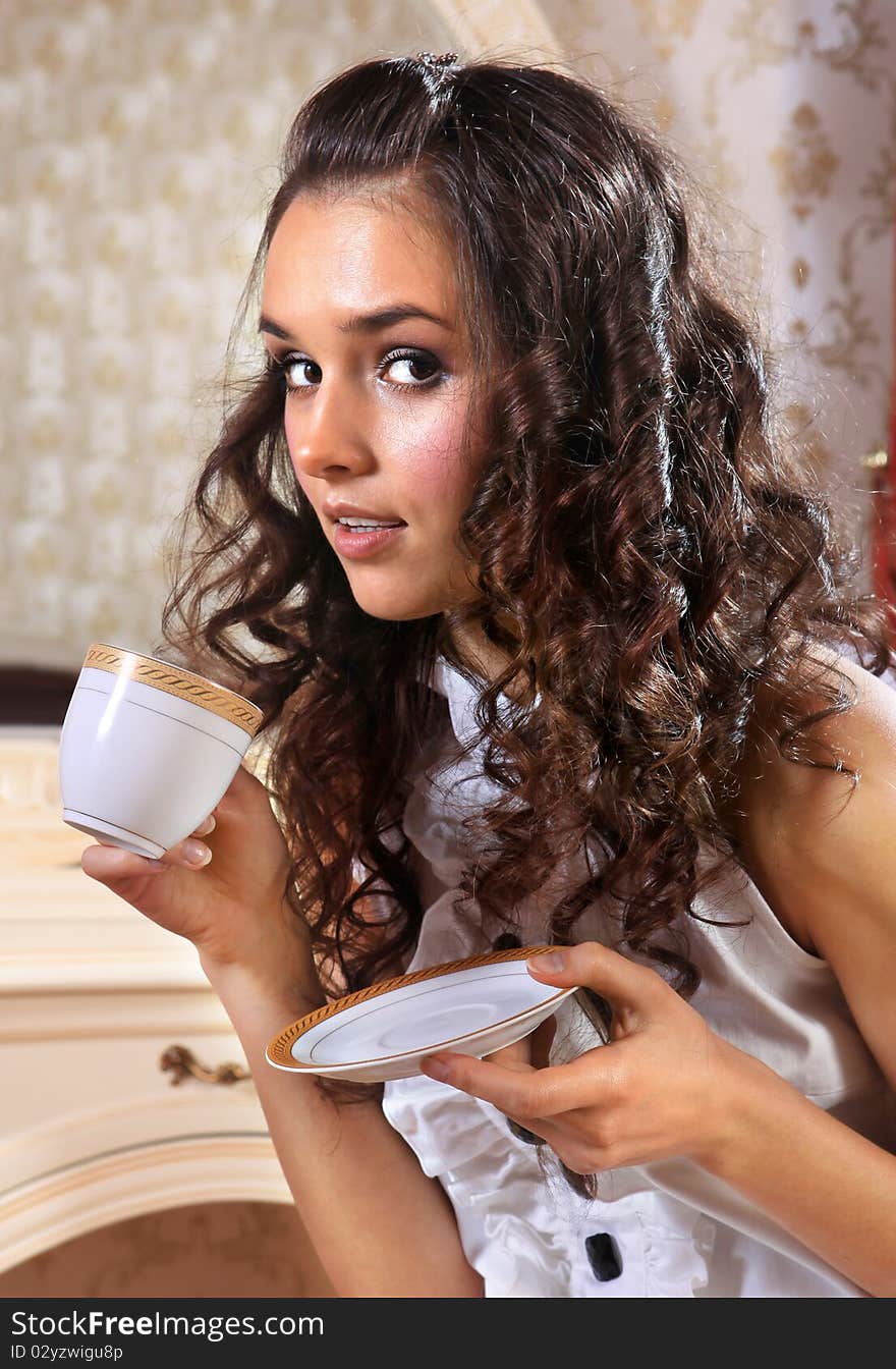 Young woman with white cup of hot drink. Young woman with white cup of hot drink