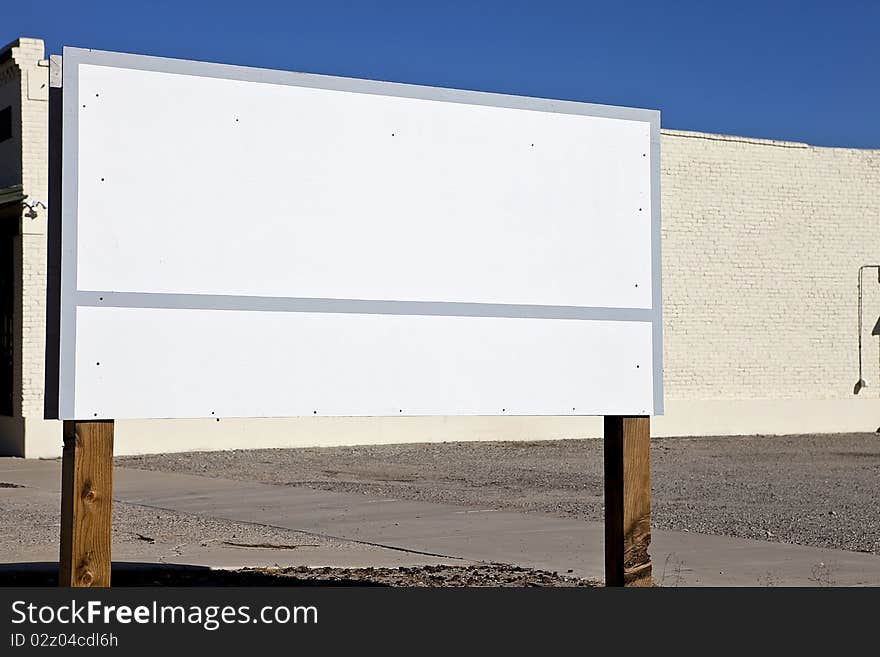 Blank, white sign on the side of a road. Blank, white sign on the side of a road