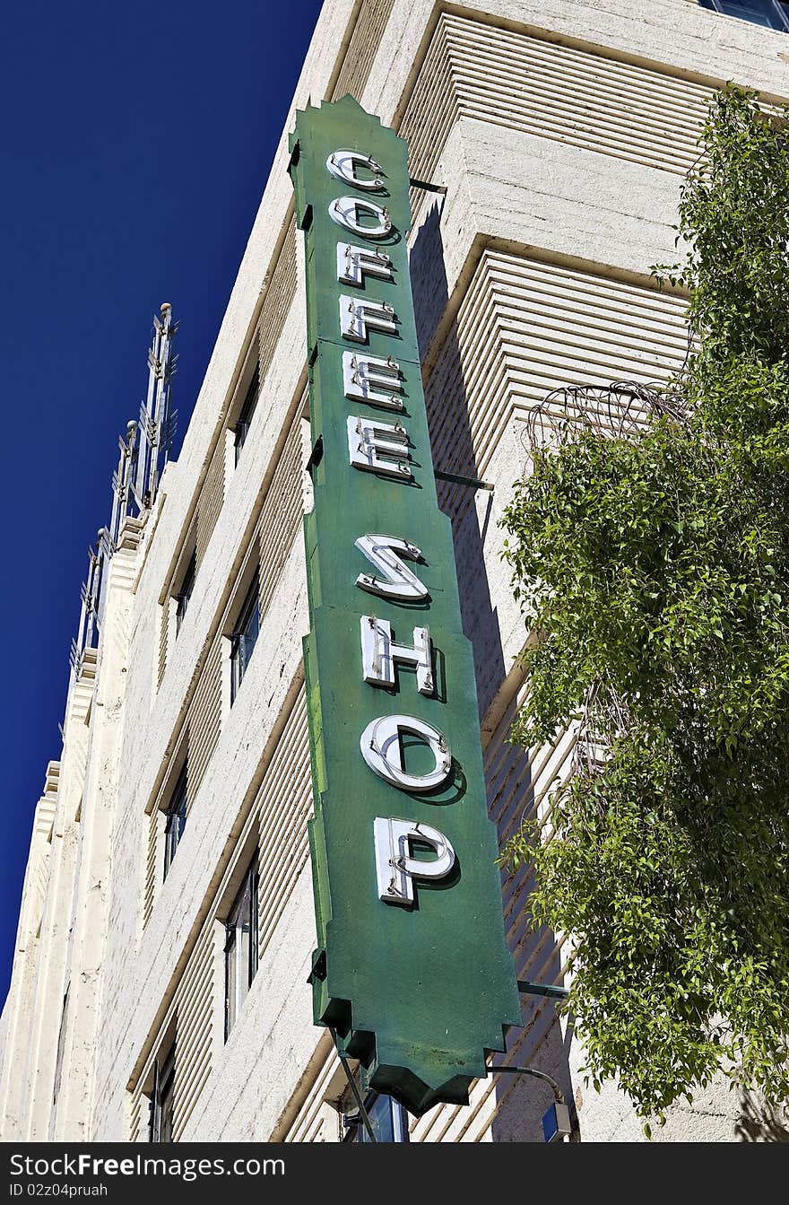 A green, retro coffee shop sign