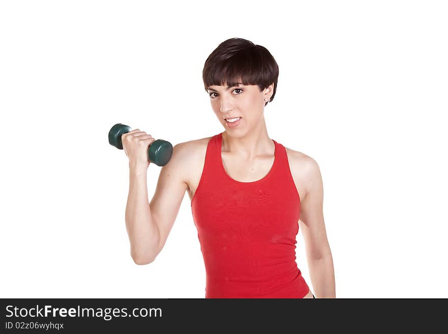 A close up of a woman holding a weight with a happy expression on her face. A close up of a woman holding a weight with a happy expression on her face.