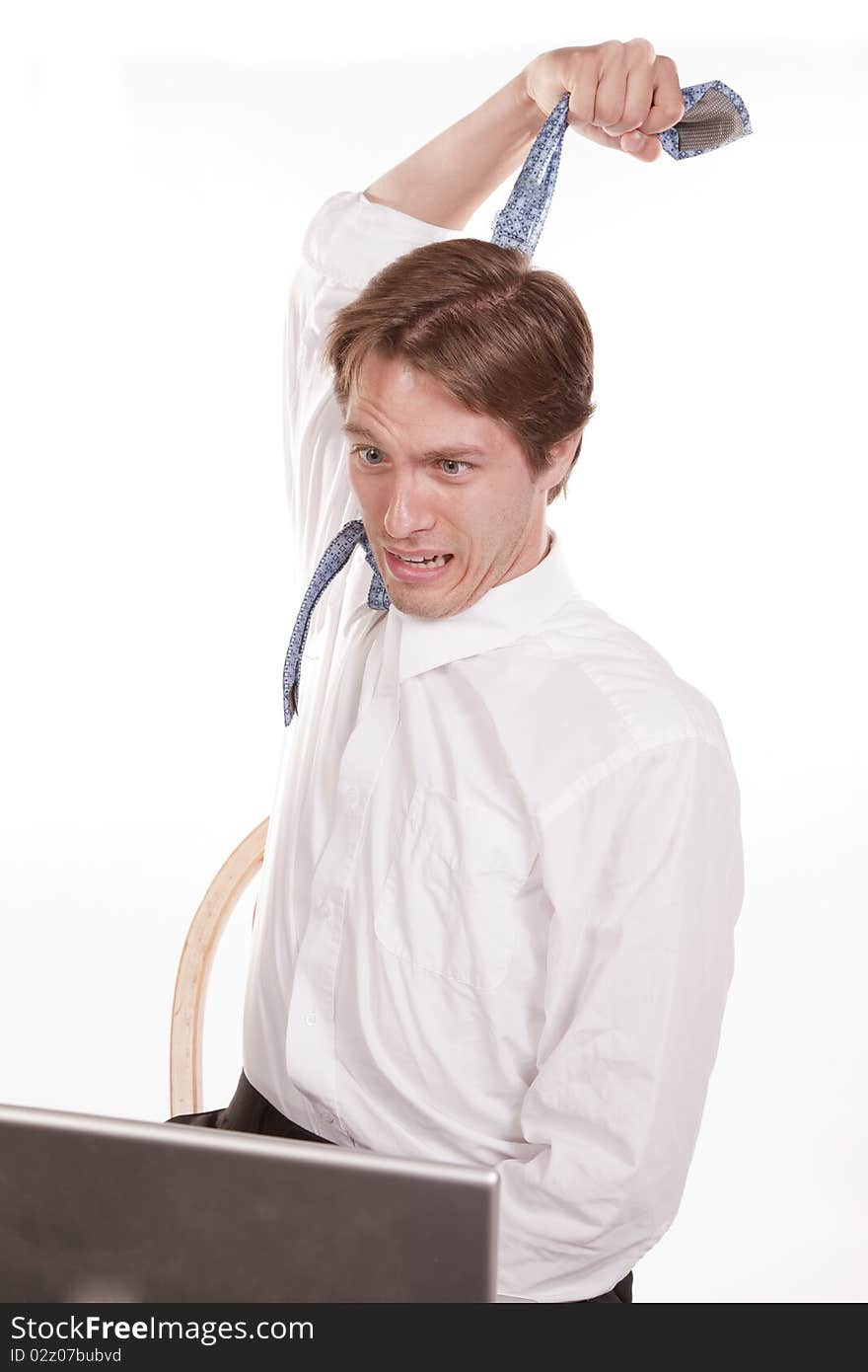 A man pulling on his tie showing that he is stressed out. A man pulling on his tie showing that he is stressed out.