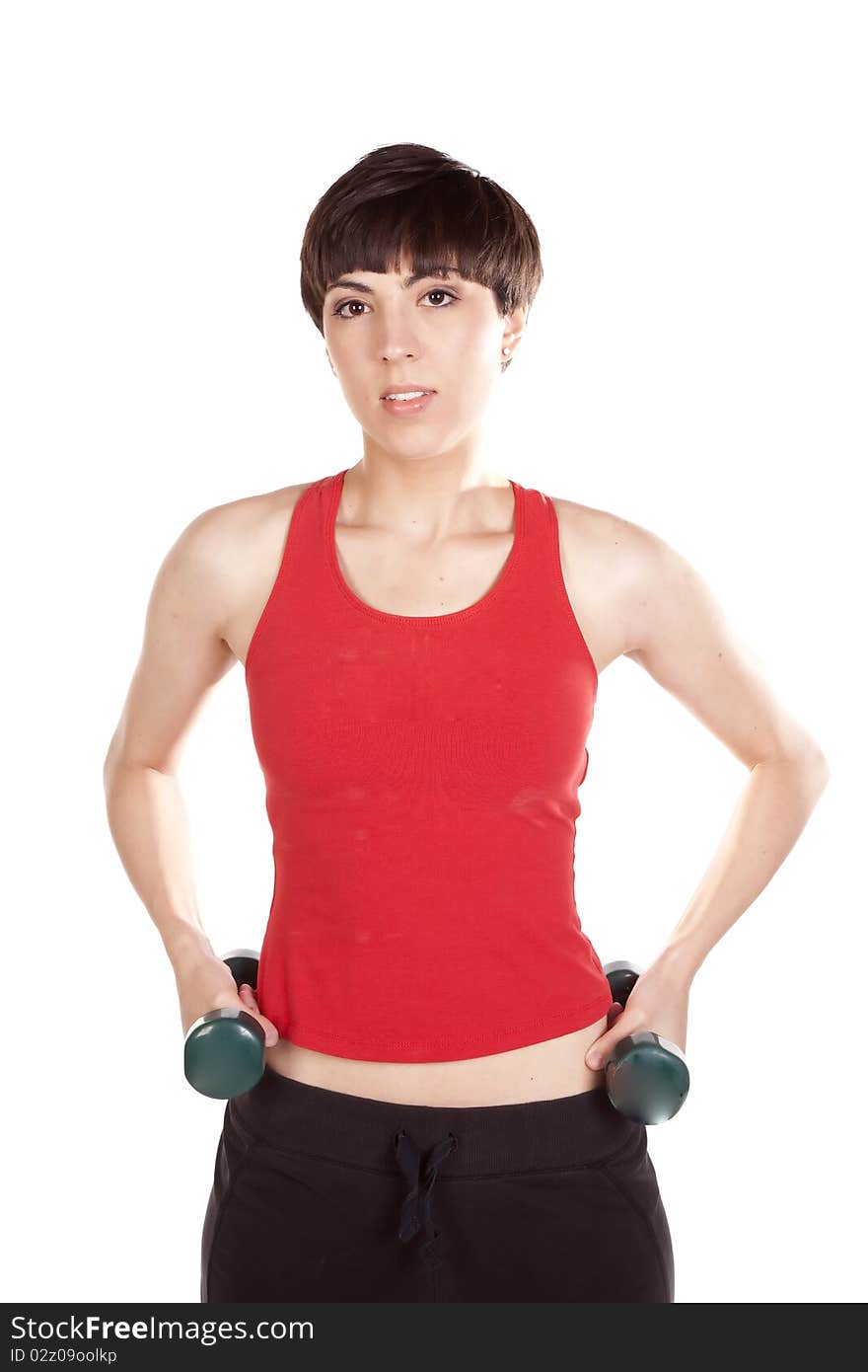 A woman holding her weights with a happy expression on her face. A woman holding her weights with a happy expression on her face.