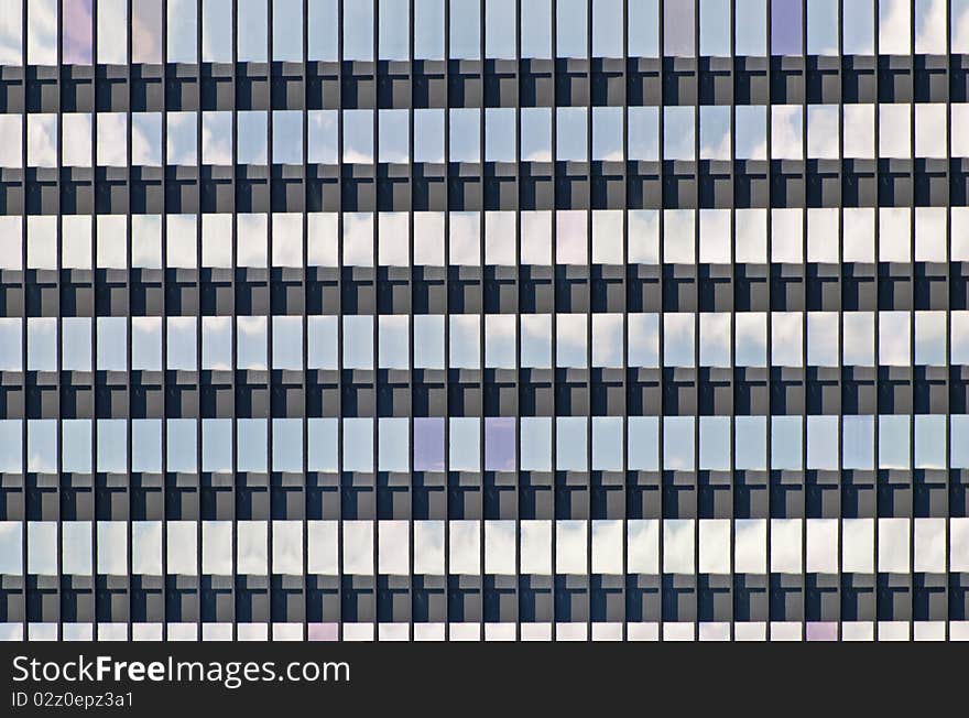 Reflection of sky in windows of an office building. Reflection of sky in windows of an office building