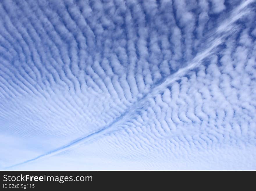 Airplane path through unique cloudy sky. Airplane path through unique cloudy sky