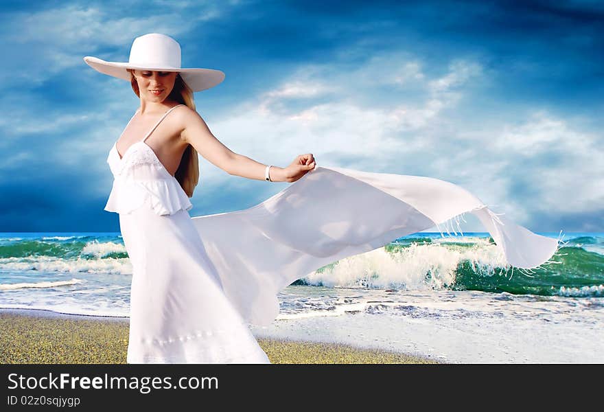 Young beautiful women in the white with pareo on the sunny tropical beach. Young beautiful women in the white with pareo on the sunny tropical beach