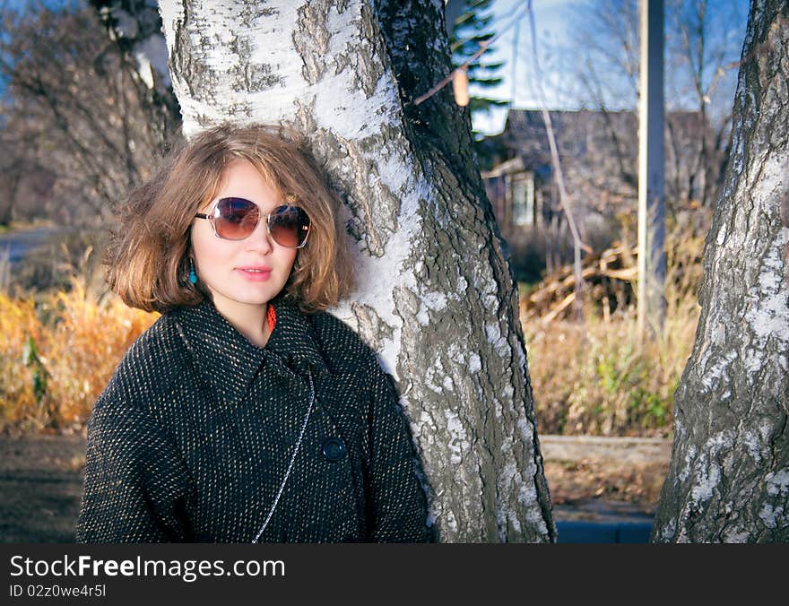 Portrait of a teenage girl in a coat