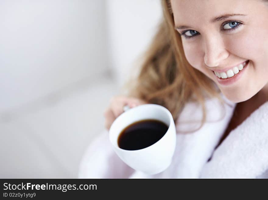 Beautiful girl with a coffee close up