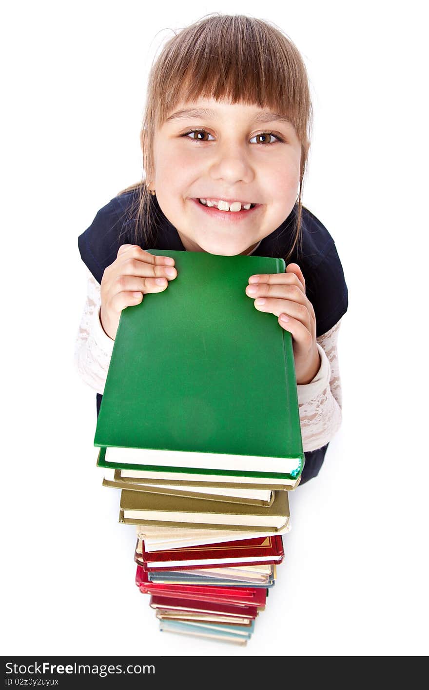 Schoolgirl with books is looking up. Isolated on white background