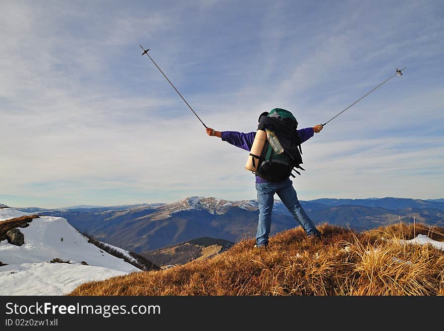 The tourist submits signals on an autumn hillside.