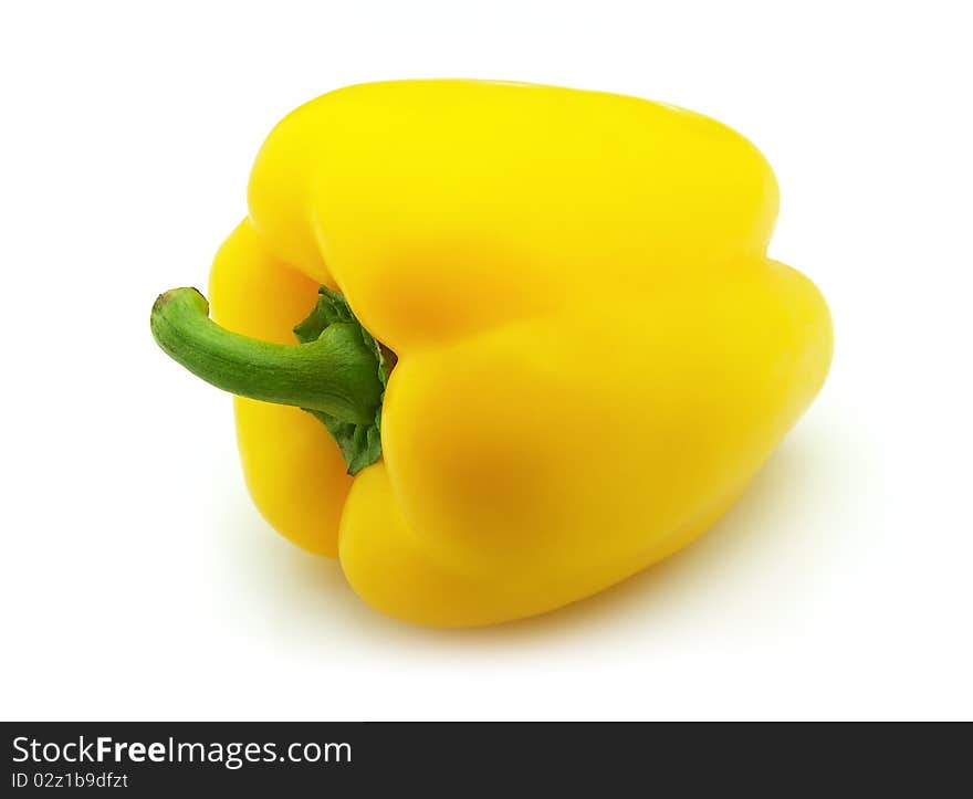 Sweet pepper of yellow color on a white background