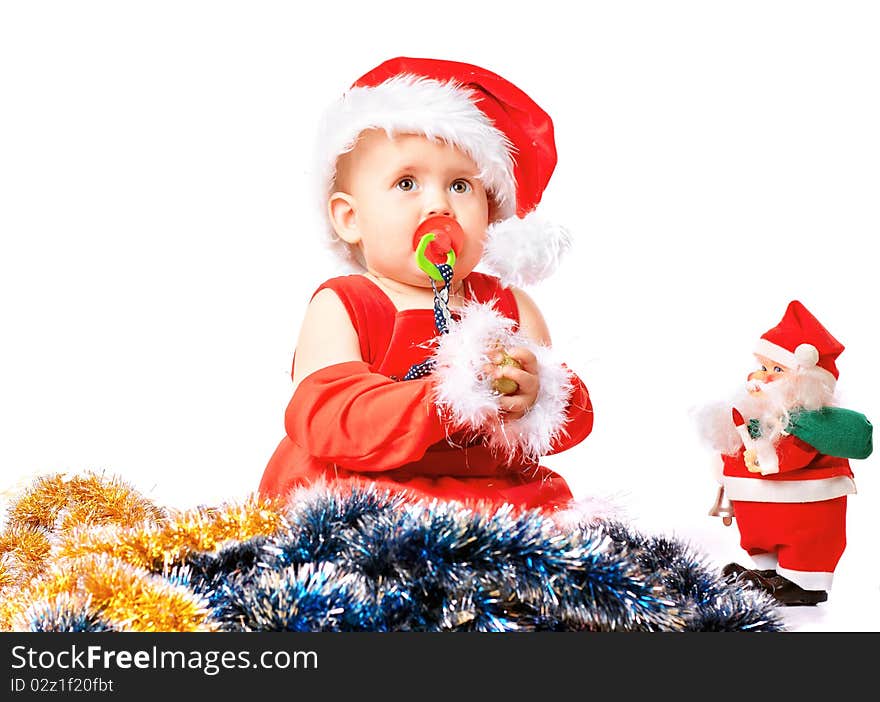 Baby in Santa Claus hat on white background