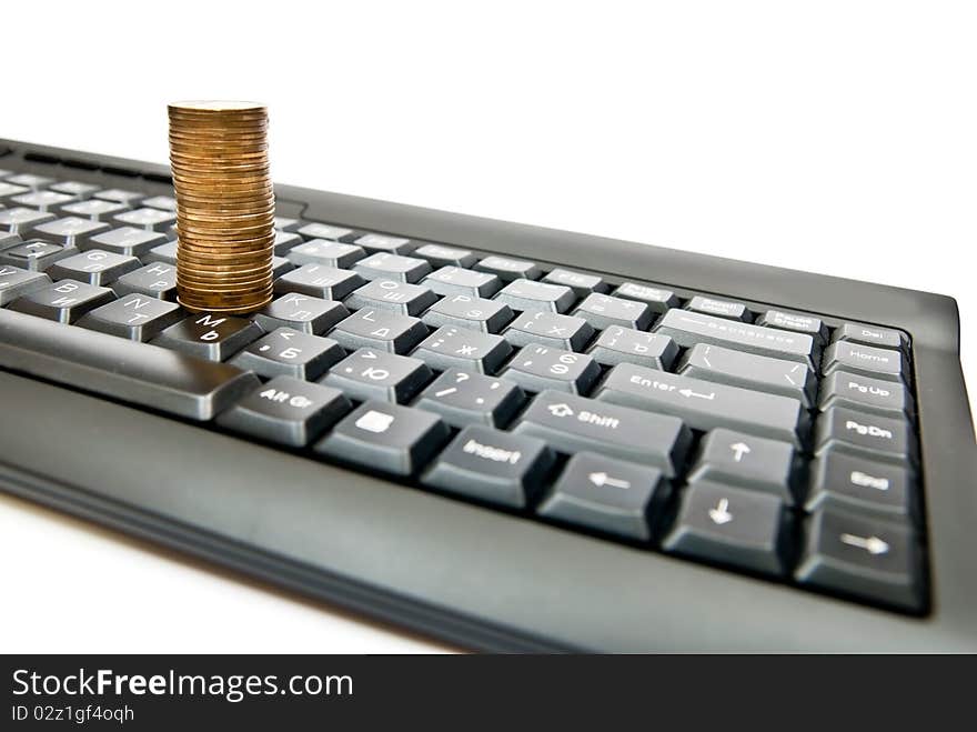 Heap of yellow coins on black keyboard. Heap of yellow coins on black keyboard