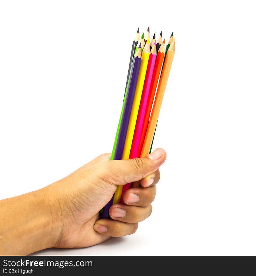 Color pencils in a hand isolated on white background. Color pencils in a hand isolated on white background.