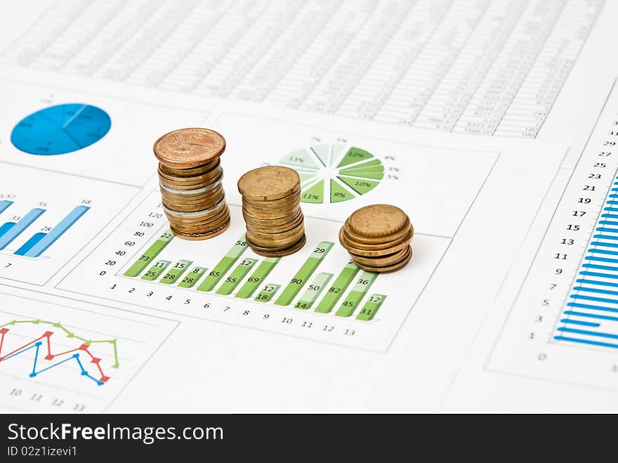 Graphs and charts with stacks of coins. Graphs and charts with stacks of coins