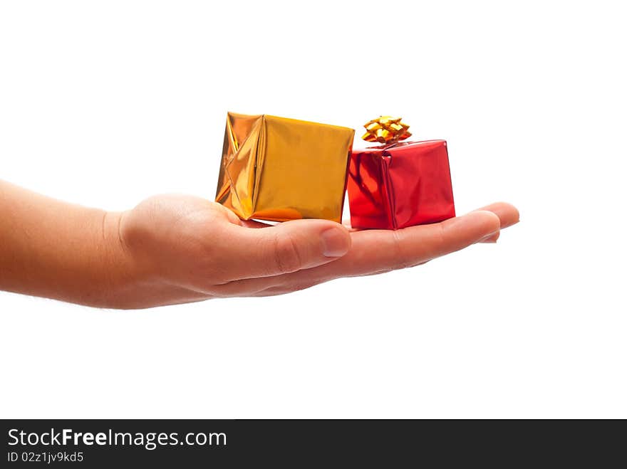 Man's hand giving a christmas gifts. Isolated on white background. Man's hand giving a christmas gifts. Isolated on white background