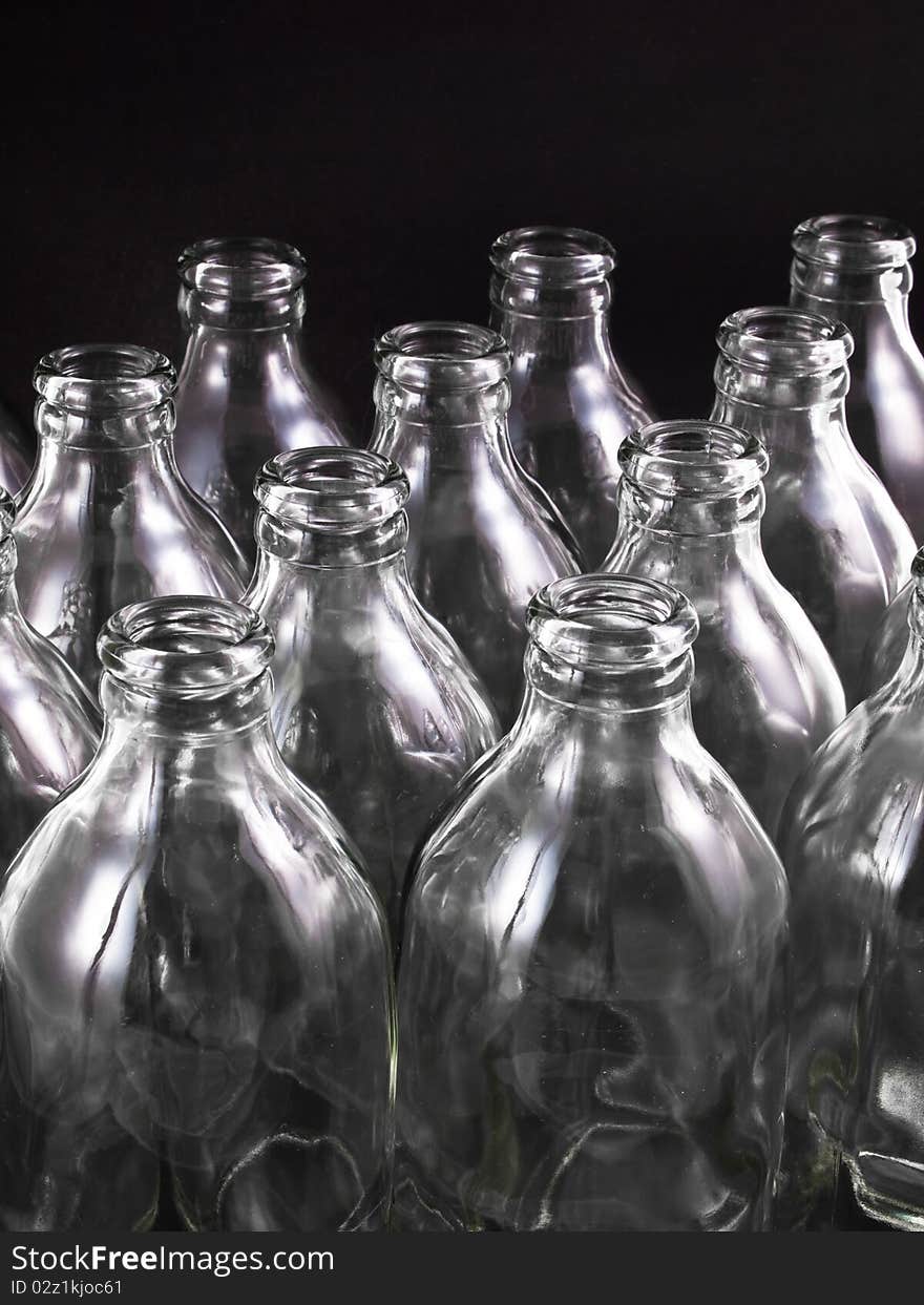 Empty bottles collection, colorless, isolated on black background