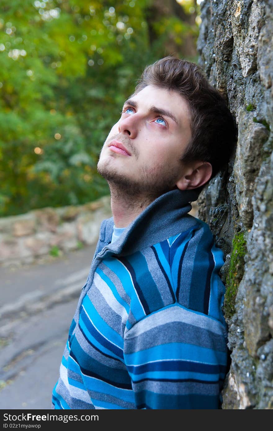 Portrait of a nice-looking casual man looking upwards. Portrait of a nice-looking casual man looking upwards