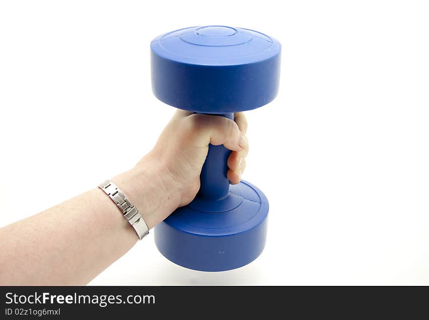 Blue dumbbell in a woman hand. Blue dumbbell in a woman hand