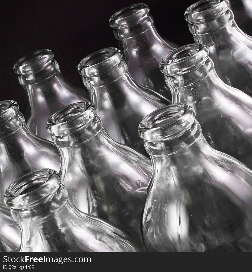 Empty bottles collection, colorless, isolated on black background