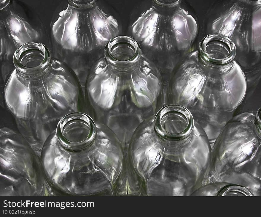 Empty bottles collection, colorless, isolated on black background